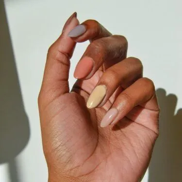 Mixed manicure of neutral nail polishes