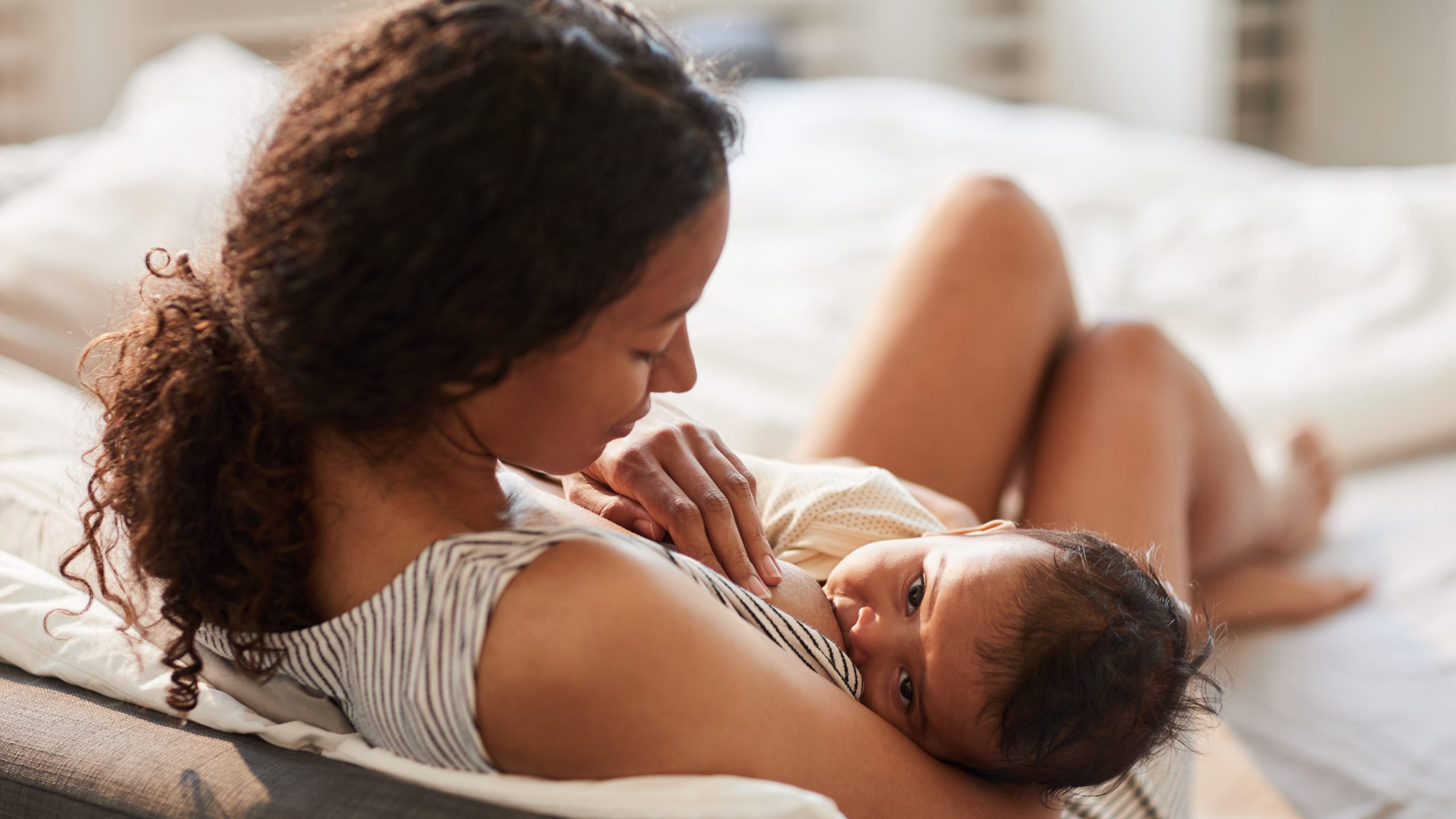 Mother breastfeeds her child